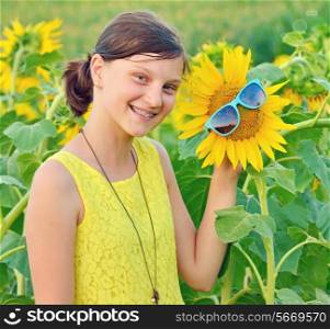 Portrait of a beautiful young Teenage on sunflower field