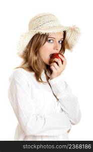 Portrait of a beautiful young woman eating a red apple