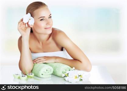 Portrait of a beautiful young woman enjoying day spa, spending time at luxury beauty clinic, skincare and aromatherapy, alternative medicine concept