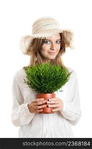 Portrait of a beautiful young woman holding a plant on her hands