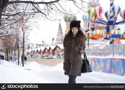 Portrait of a beautiful young woman in a mink hat on a red square, Moscow Russia (2015)