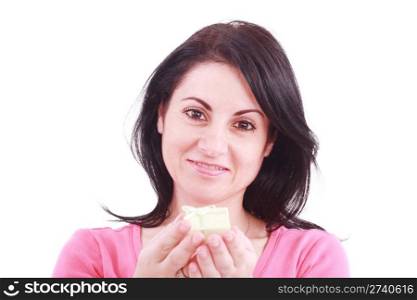 Portrait of a beautiful young woman offering a present in a white background