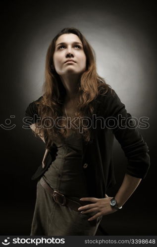 Portrait of a beautiful young woman on a dark background