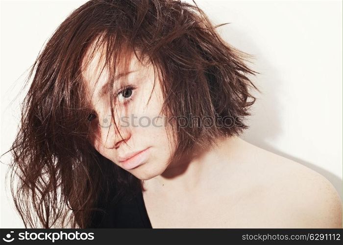 Portrait of a beautiful young woman on white background