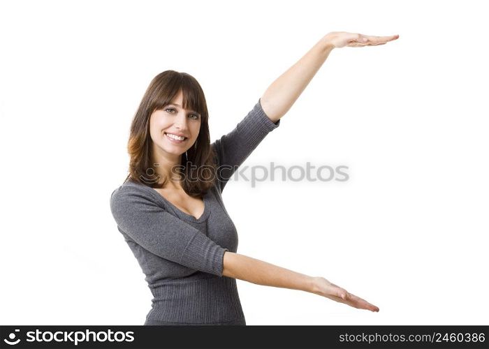 Portrait of a beautiful young woman showing her arms open, isolated on white background