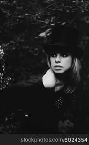 Portrait of a beautiful young woman wearing a high hat