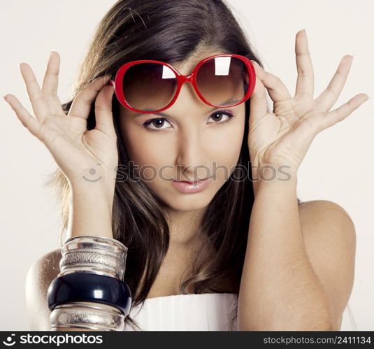 Portrait of a beautiful young woman wearing sunglasses