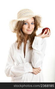 Portrait of a beautiful young woman with a red healthy apple