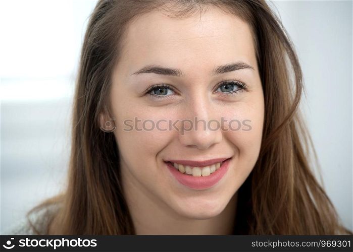 portrait of a beautiful young woman with long hair