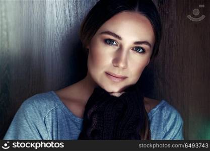 Portrait of a beautiful young woman with natural makeup over wooden background, calm and peaceful female, genuine womens beauty concept. Genuine women&rsquo;s beauty