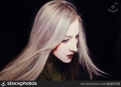 Portrait of a beautiful young woman with white make-up simulating a Japanese doll