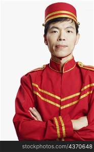 Portrait of a bellhop with his arms crossed