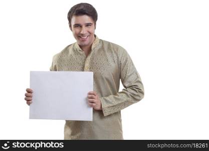 Portrait of a Bengali man holding a white placard