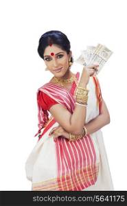 Portrait of a Bengali woman holding currency notes
