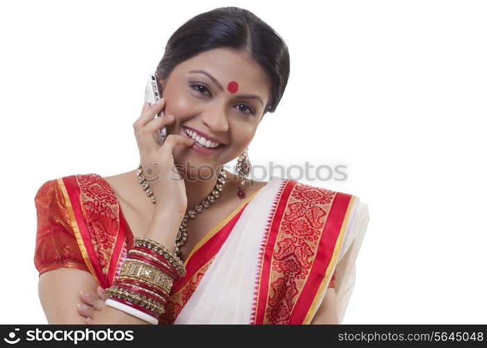 Portrait of a Bengali woman talking on a mobile phone
