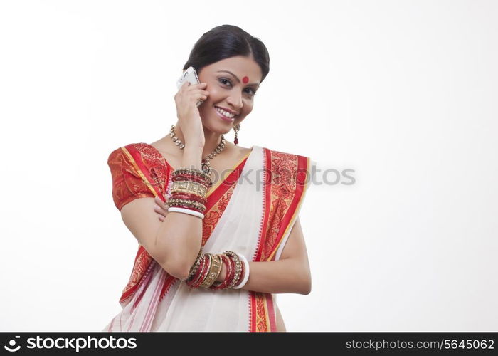 Portrait of a Bengali woman talking on a mobile phone