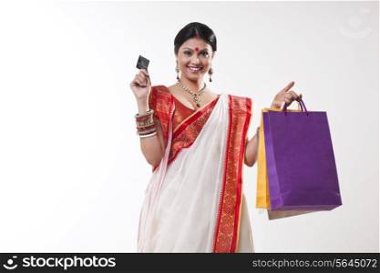 Portrait of a Bengali woman with shopping bags and credit card