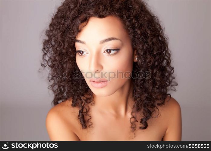 Portrait of a beuatiful mix race woman over white background