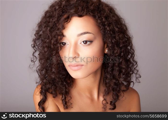 Portrait of a beuatiful mix race woman over white background