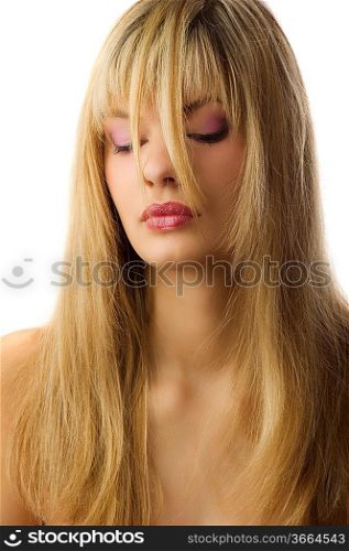 portrait of a blond girl with long hair brushed in front of her face