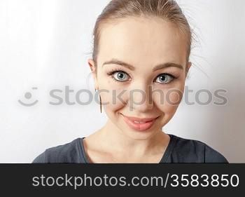 portrait of a blonde woman with a lovely smile