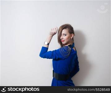 Portrait of a blonde woman with fashion hairstyle against light wall and a lot of copy-cpace. beautiful woman
