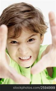 Portrait of a boy clenching his teeth