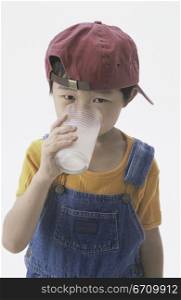 Portrait of a boy drinking a glass of milk