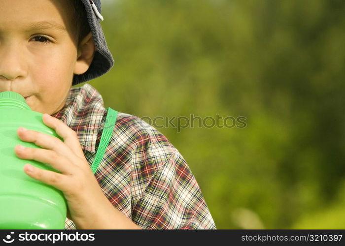 Portrait of a boy drinking water