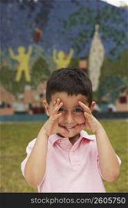 Portrait of a boy gesturing