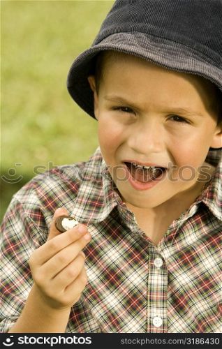 Portrait of a boy holding a chocolate