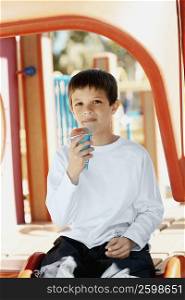 Portrait of a boy holding an ice-cream cone