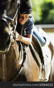 Portrait of a boy horseback riding