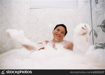 Portrait of a boy in a bubble bath