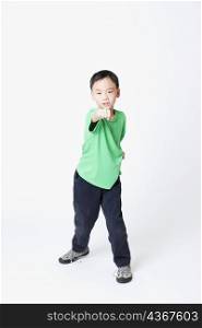 Portrait of a boy in a fighting stance