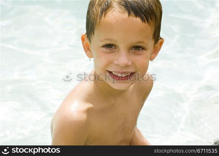 Portrait of a boy in water