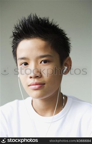 Portrait of a boy listening to headphones