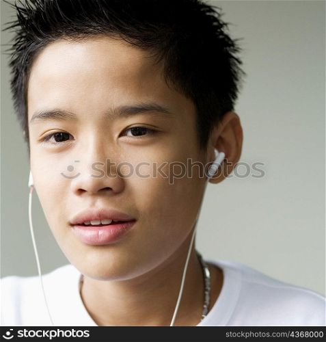 Portrait of a boy listening to headphones