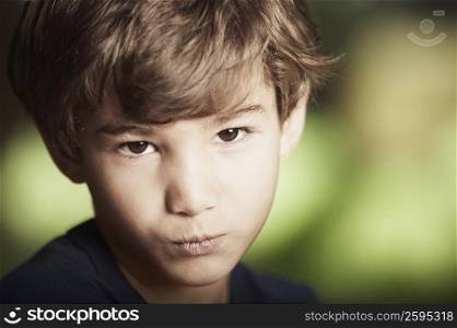 Portrait of a boy puckering his lips