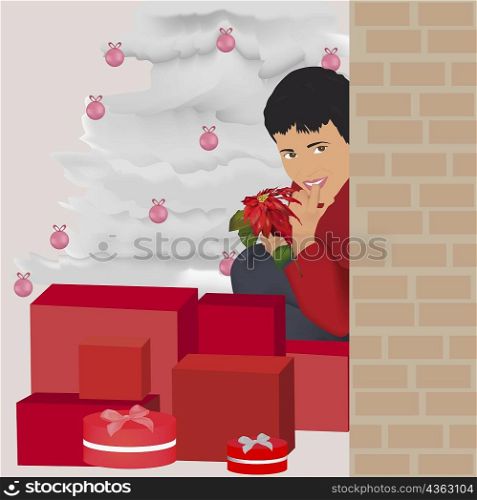 Portrait of a boy sitting with Christmas presents