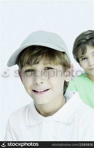 Portrait of a boy smiling with his friend in the background