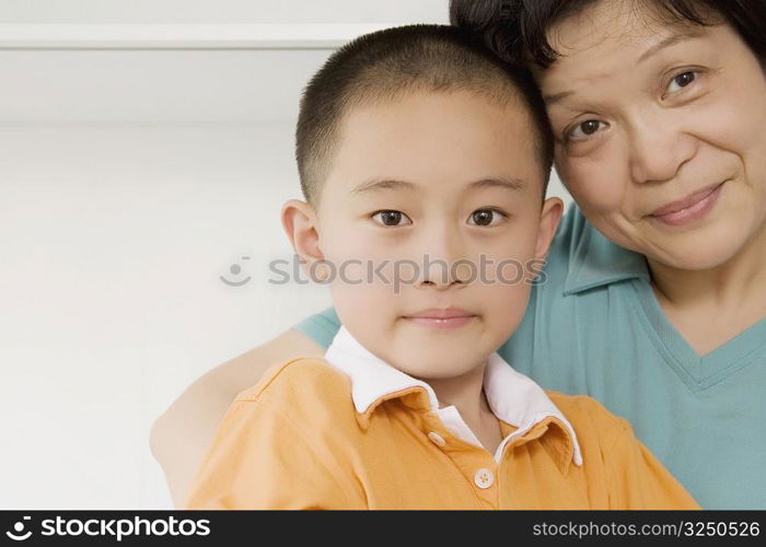 Portrait of a boy smiling with his grandmother