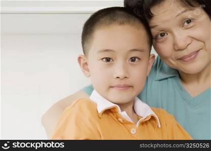 Portrait of a boy smiling with his grandmother