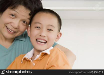 Portrait of a boy smiling with his grandmother