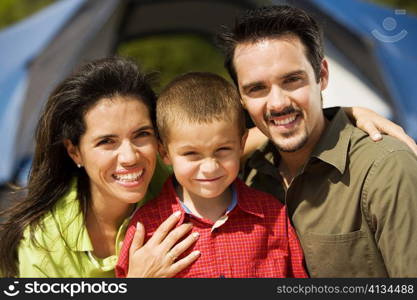 Portrait of a boy smiling with his parents