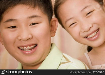 Portrait of a boy smiling with his sister