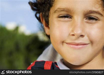Portrait of a boy smirking