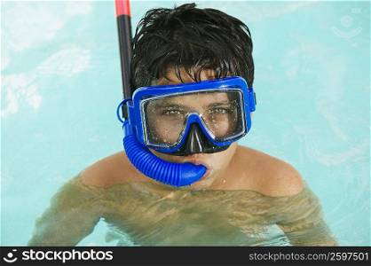 Portrait of a boy snorkeling in a swimming pool