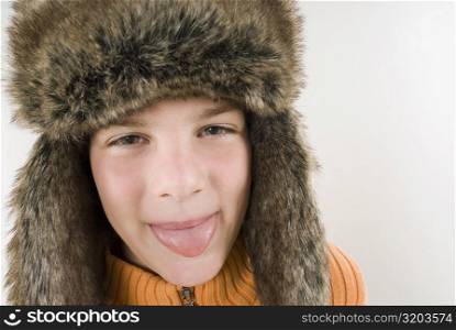 Portrait of a boy sticking his tongue out
