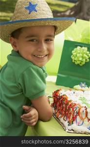 Portrait of a boy wearing a cowboy hat at a birthday party